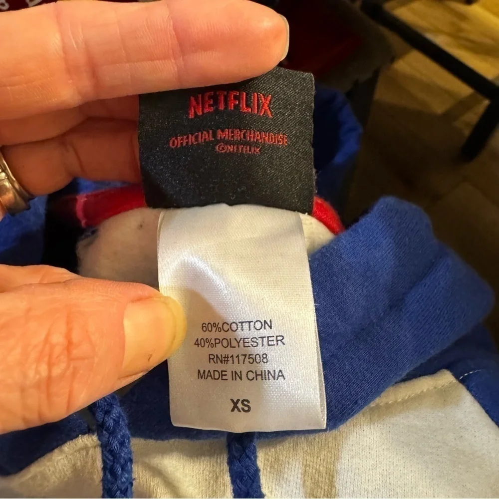 3 sweatshirts, Stranger Things, purple gray zip up, panda bears, similar fit.
